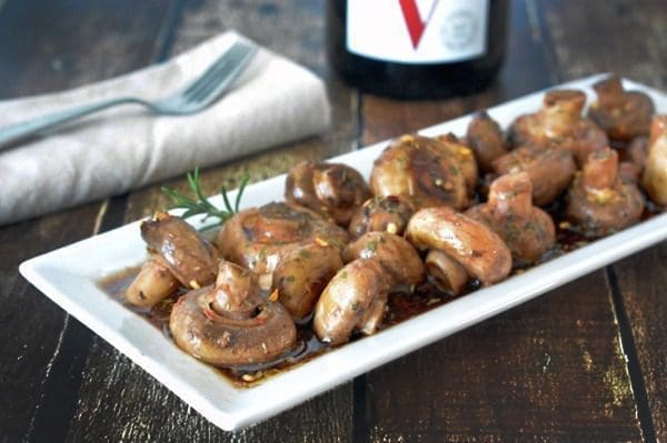 Sauteed Mushrooms on a white rectangle serving platter.