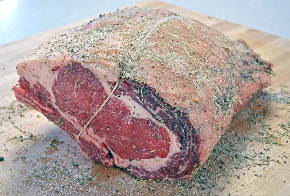 Image of uncooked standing rib roast with string