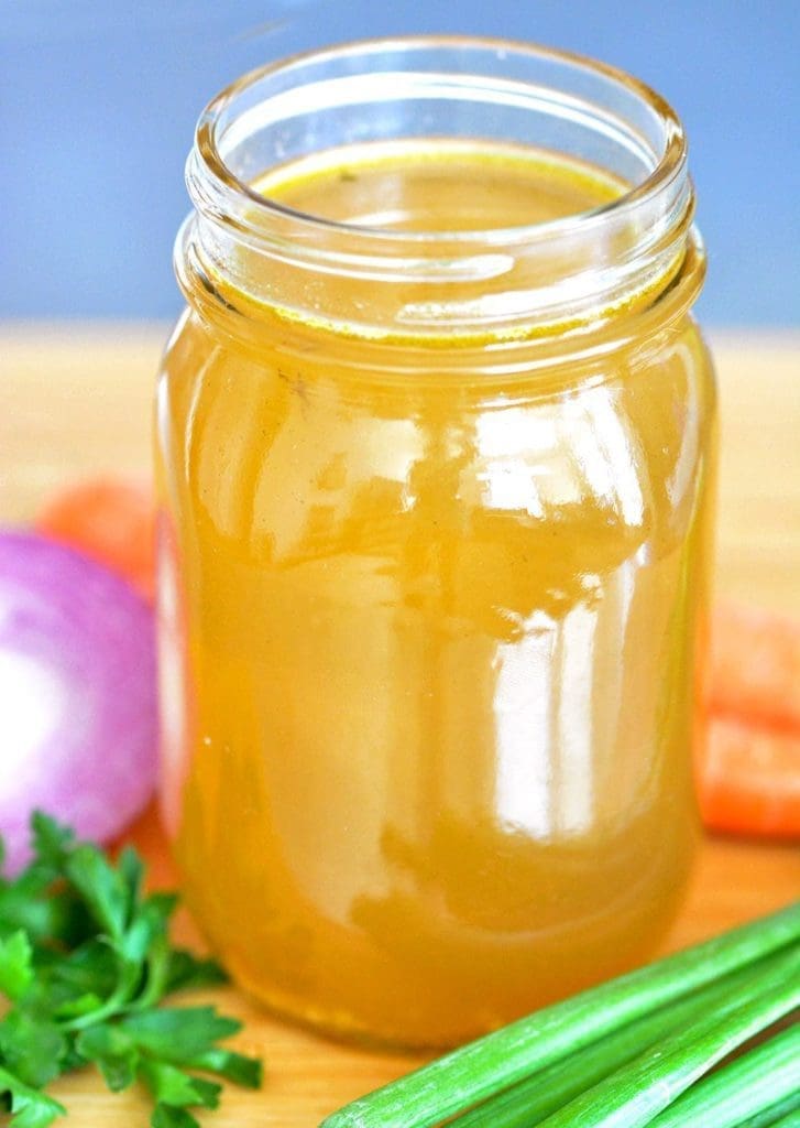 mason jar full of vegetable stock.