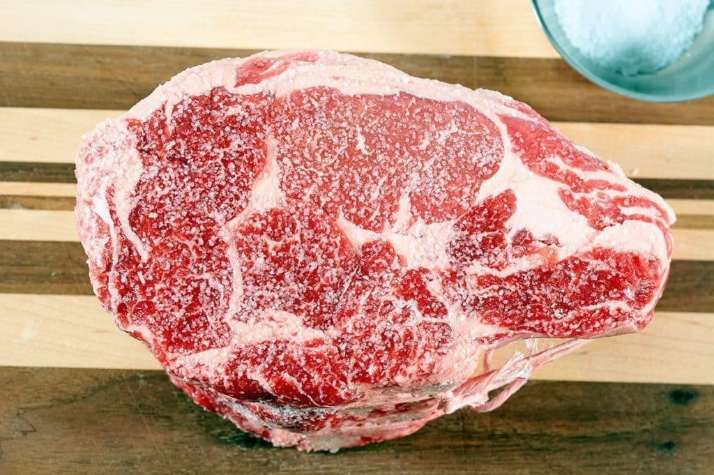 Dry Brine prime rib on a cutting board.