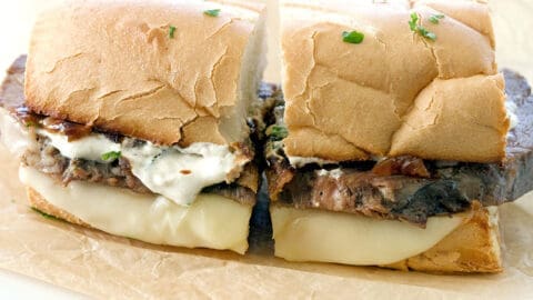 Prime rib sandwich cut in half.