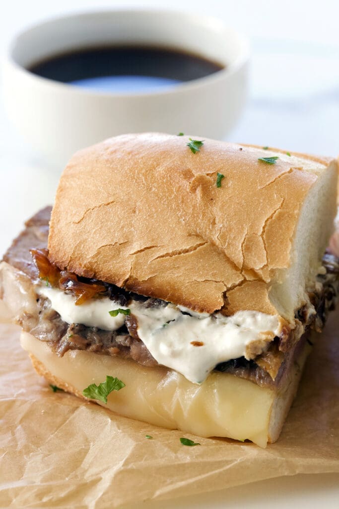 Cut the prime rib sandwich.