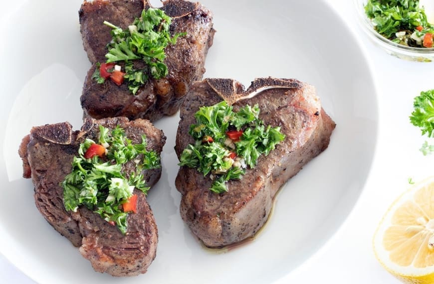 3 Sous Vide Lamb Chops topped with mint chimichurri.