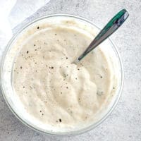 Bowl of horseradish sauce with a spoon.