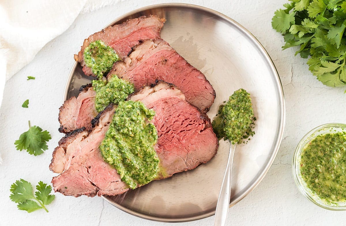 Picanha steak topped with chimichurri.