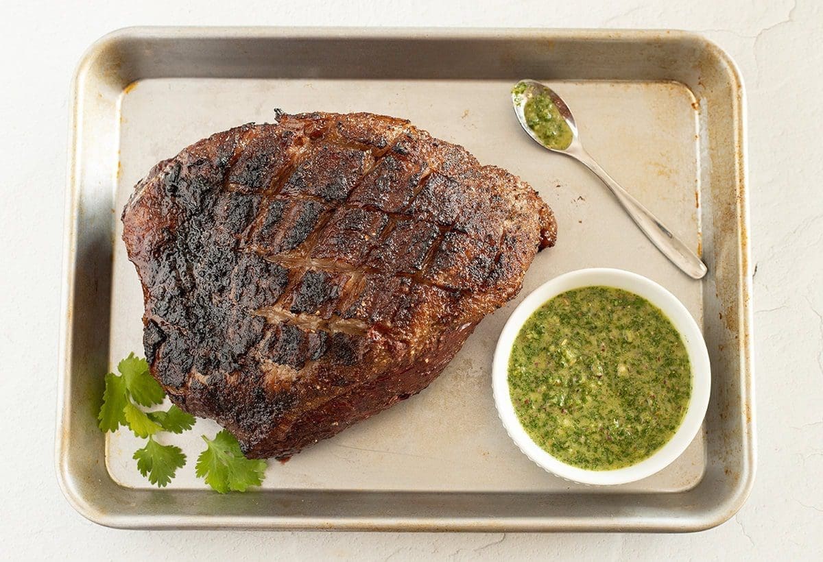 Grilled Picanha Steak with a side of chimichurri.