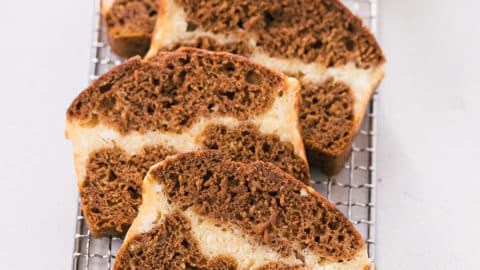4 slices of pumpkin bread with cream cheese.