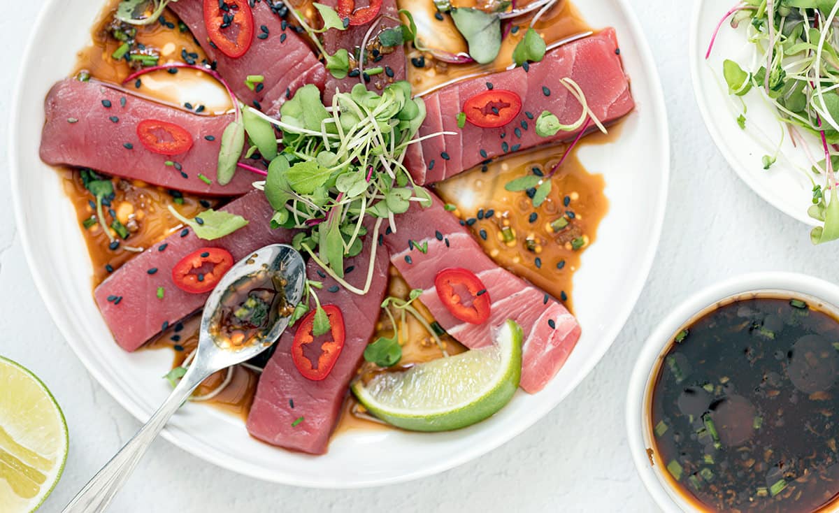 Tuna crudo on a white plate.