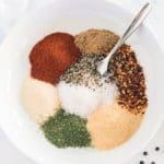 Montreal steak seasoning unmixed in a white bowl.