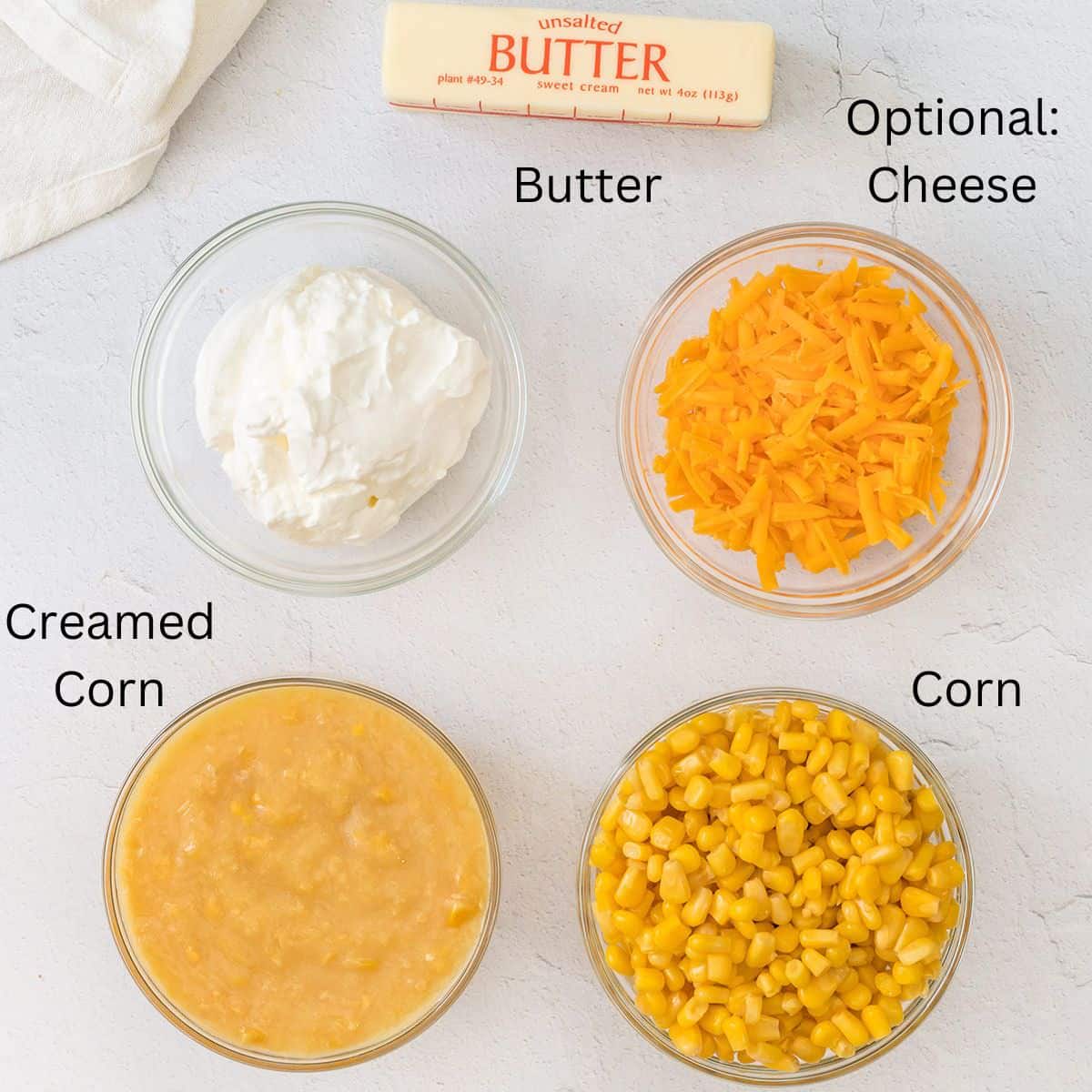 Mixing bowl with corn, cheese and sour cream.