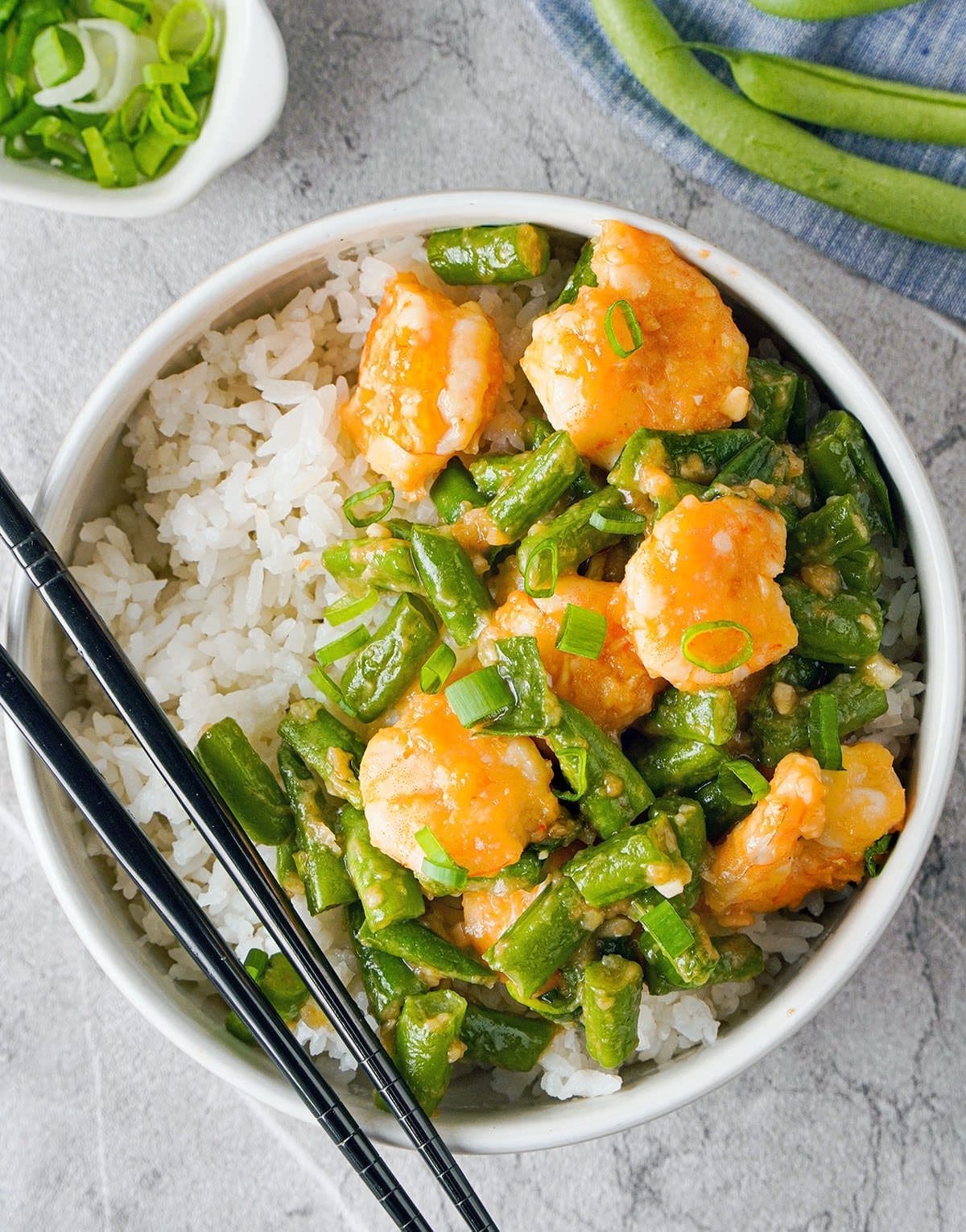 Bowl of Hunan Shrimp with chop sticks.