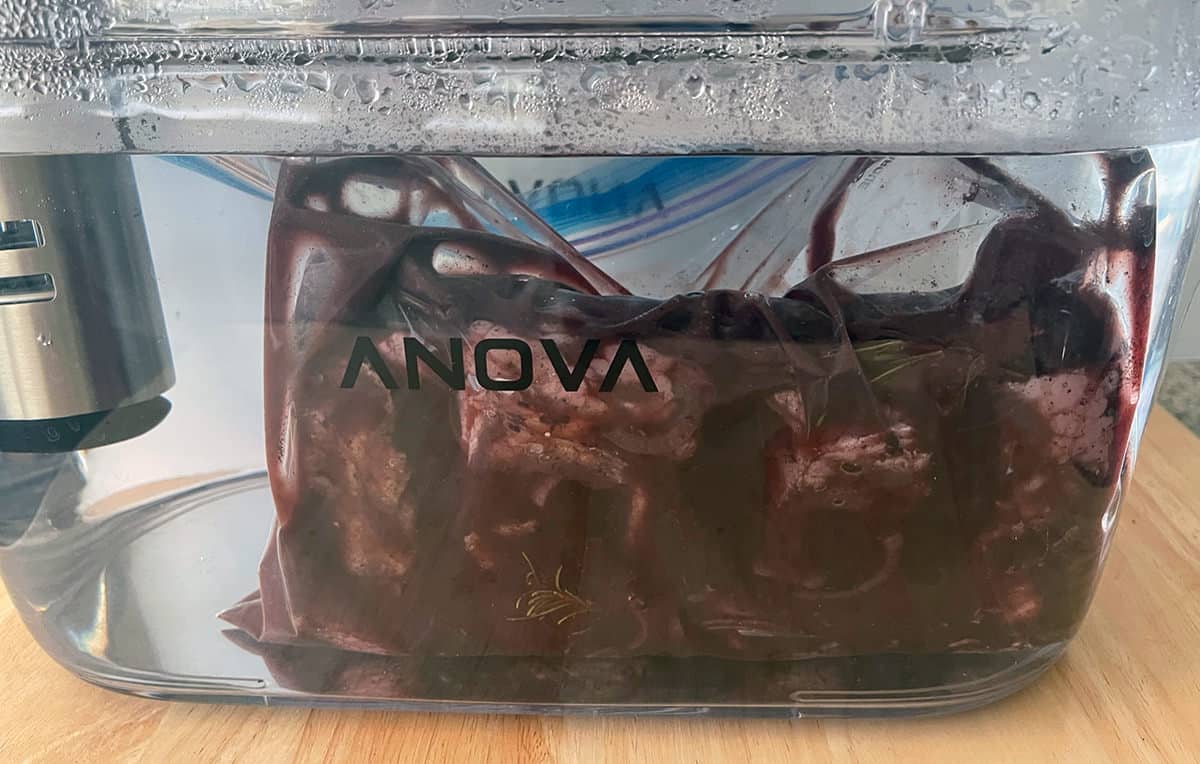 Meat in a vacuum sealed bag under water.