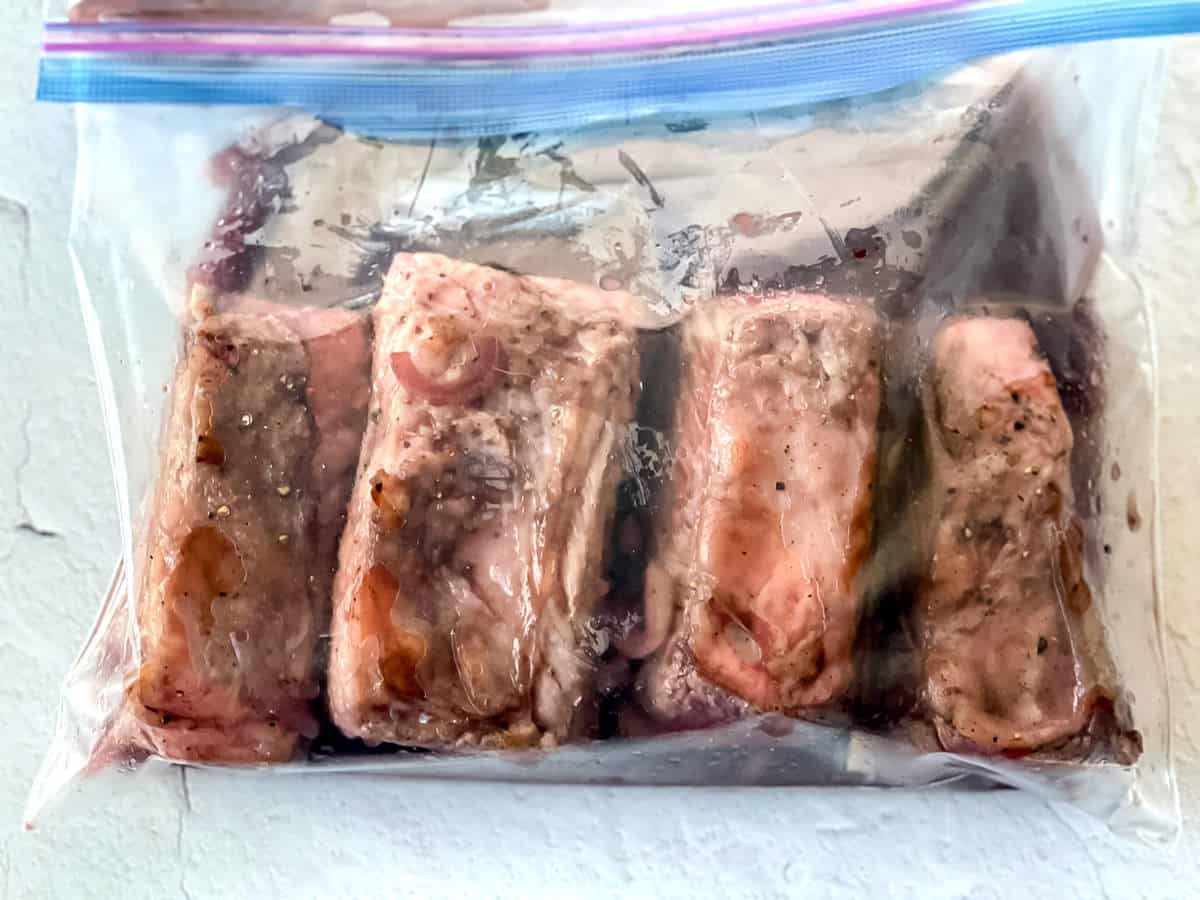 Raw beef ribs in a Ziploc bag.