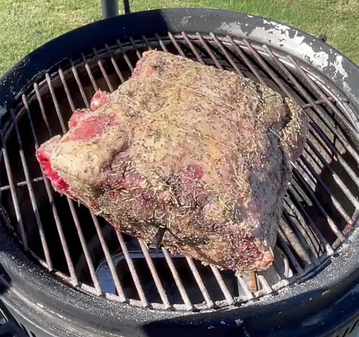 Smoked prime rib on a grill.