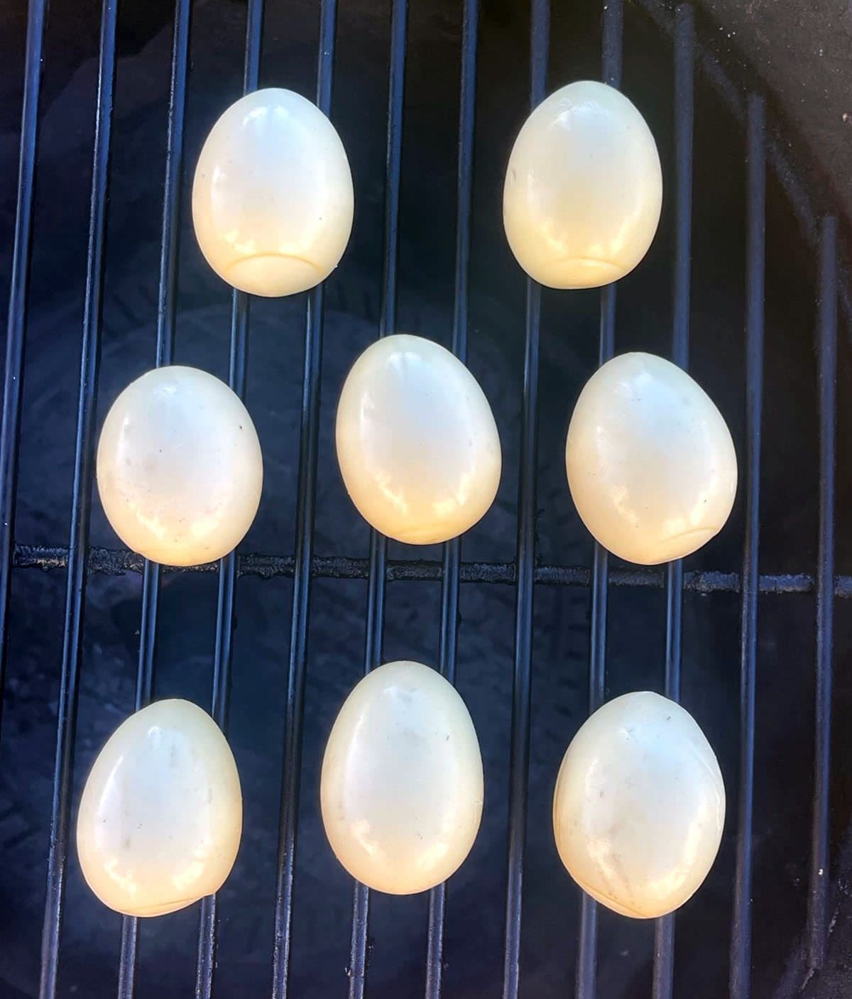 Cooked eggs on a grill.