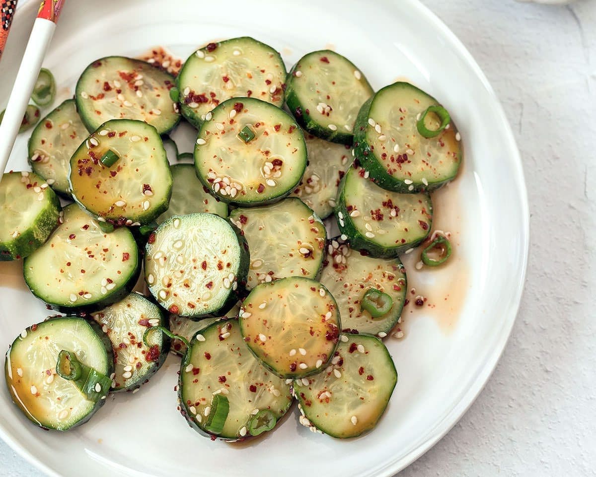 Korean cucumber salad on a white plate.