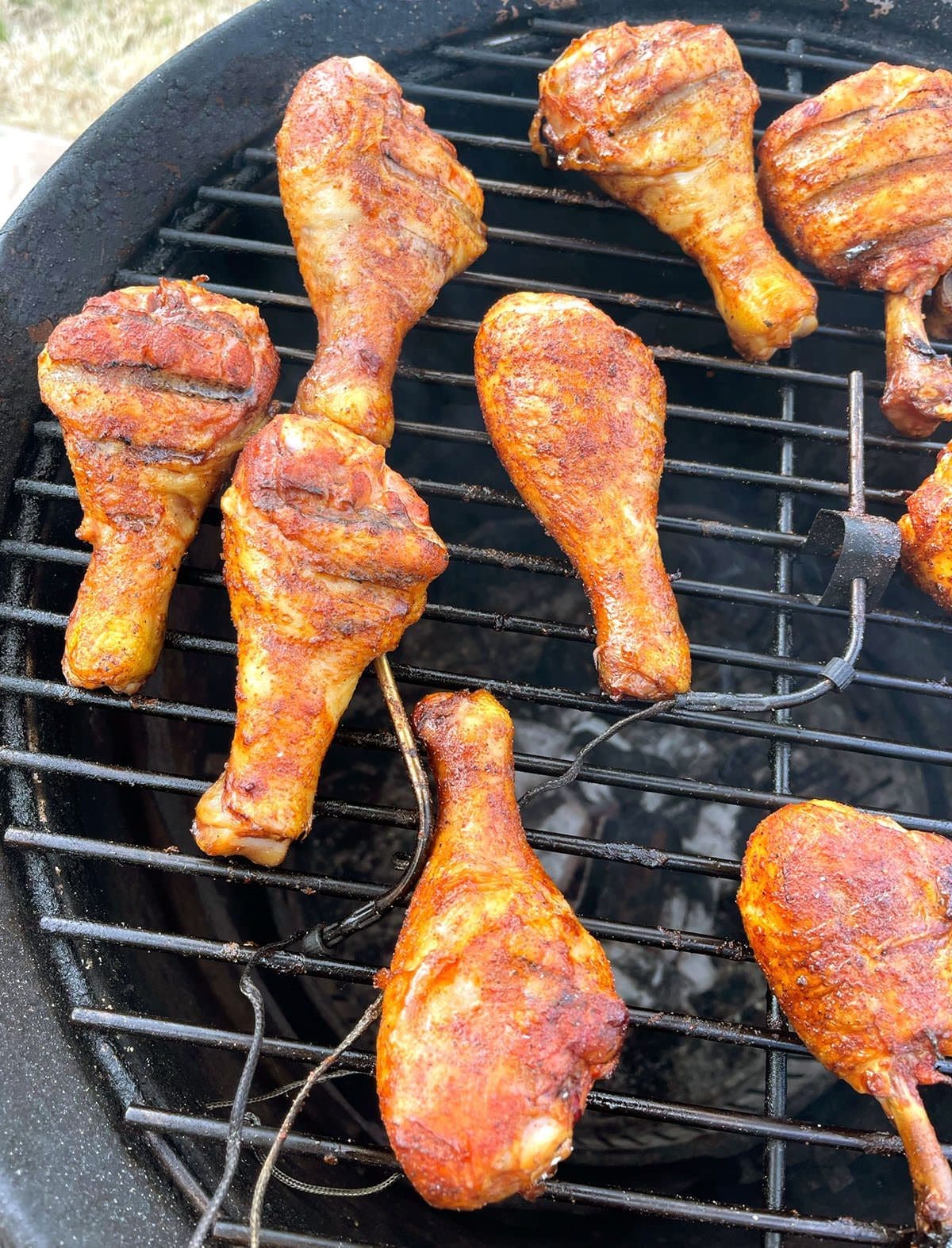 Poultry cooking on a grill.