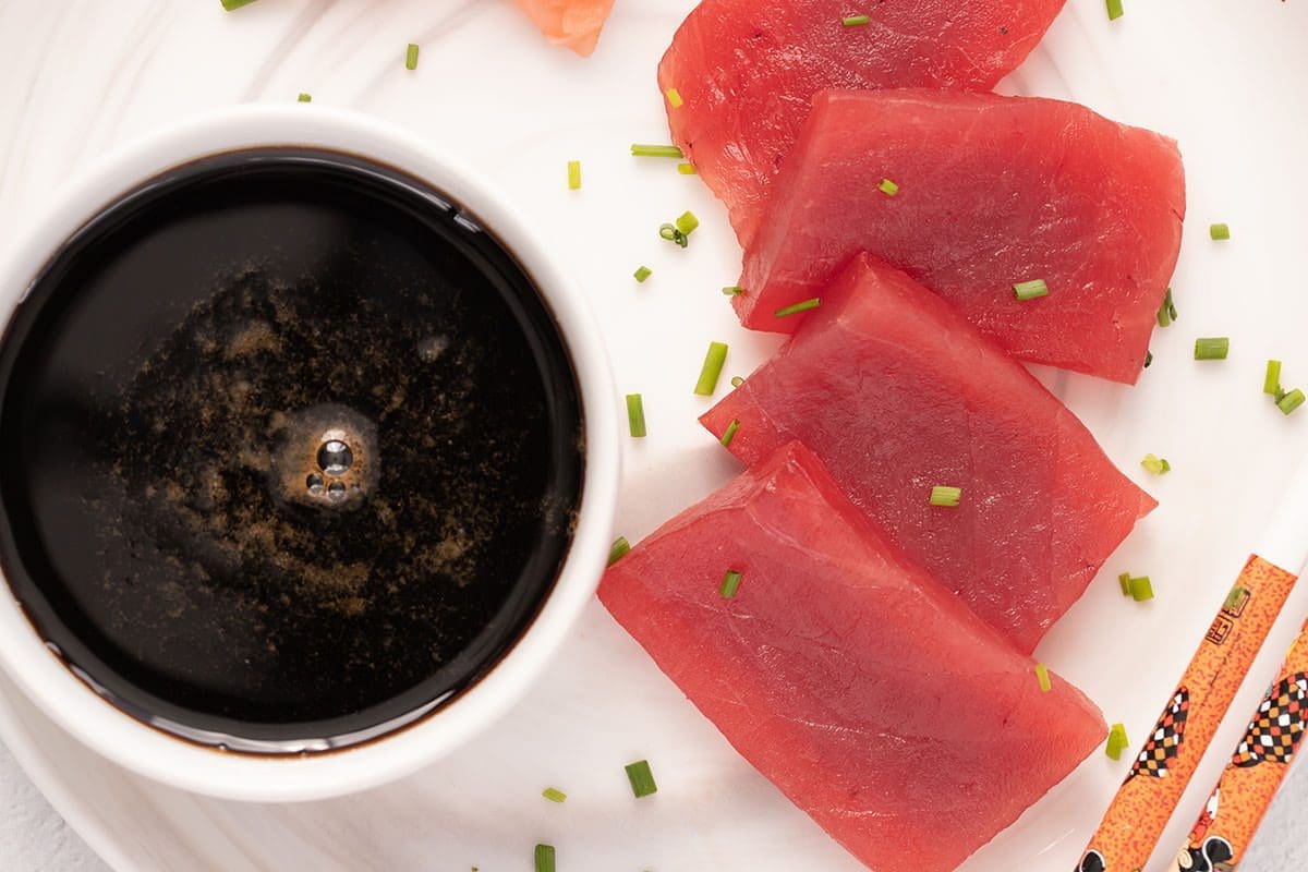 Fresh slices of raw tuna with a bowl of Nitsume.
