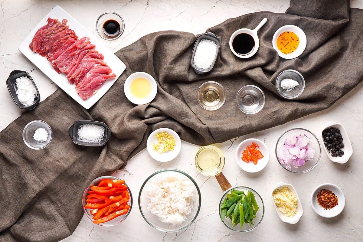 Individual ingredients in bowls to show what Hunan beef is.