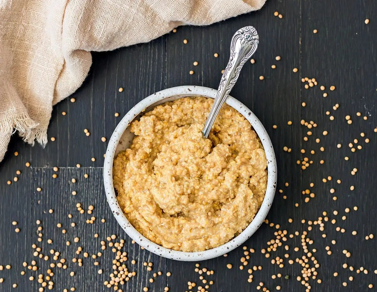 Dijon mustard recipe in a small bowl with a silver spoon.