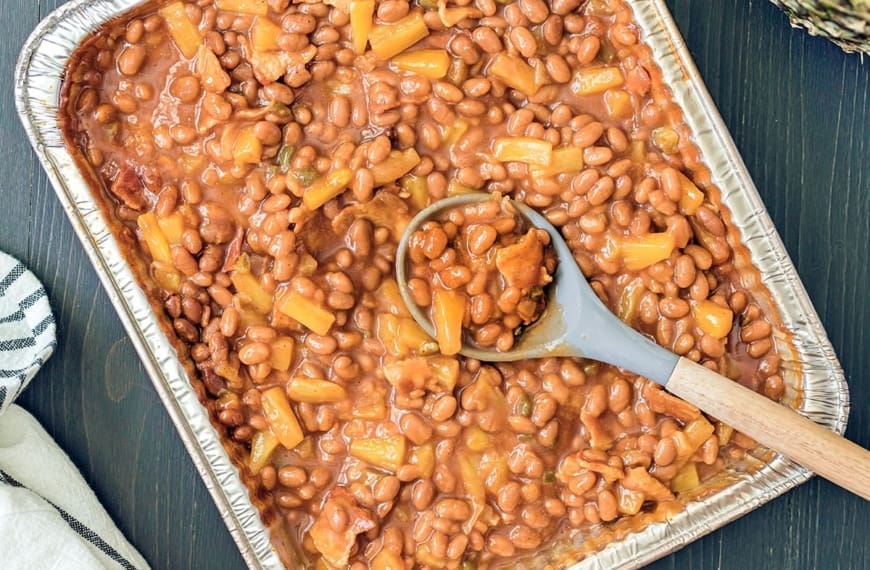 smoked baked beans in an aluminum pan.