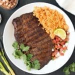 Carne asada platter with steak, rice and pico de gallo.