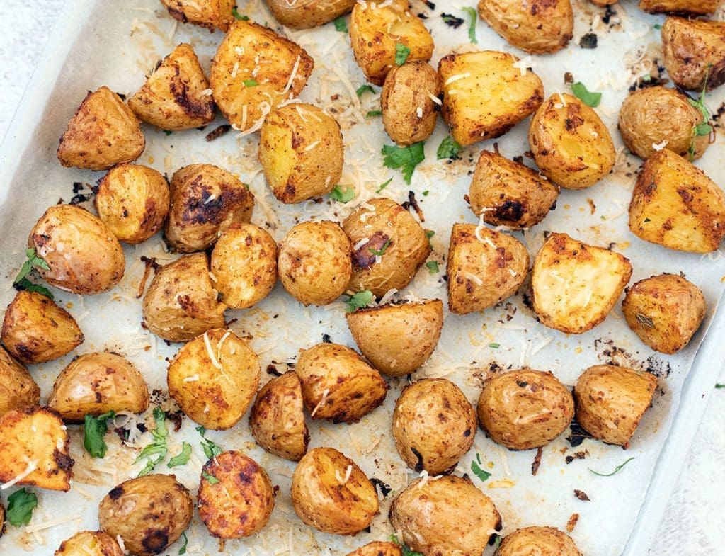 Sheet pan covered with roasted Mexican potatoes.