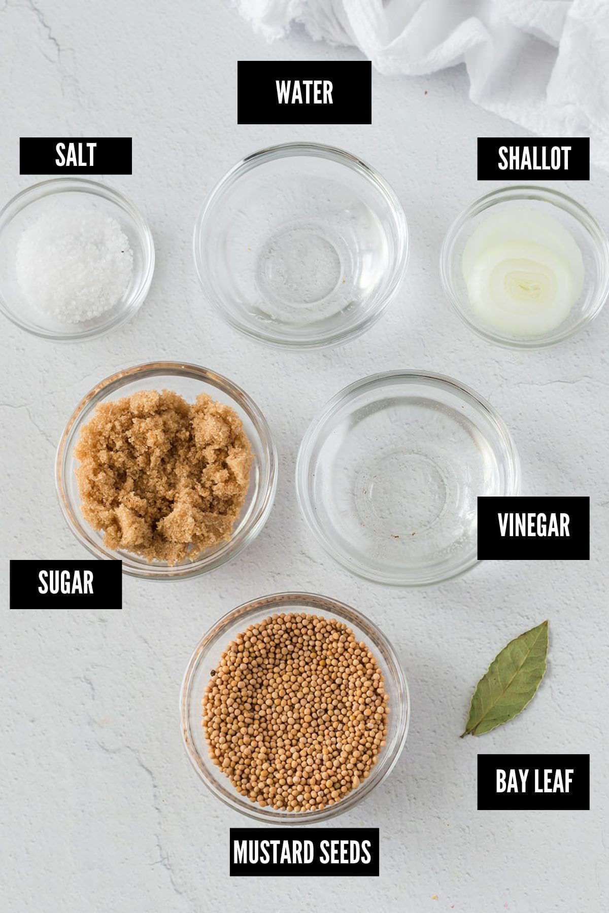 variety of labeled ingredients to make pickled mustard seeds.