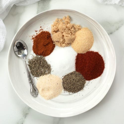 Dry Rub For Chicken spices on a white plate.