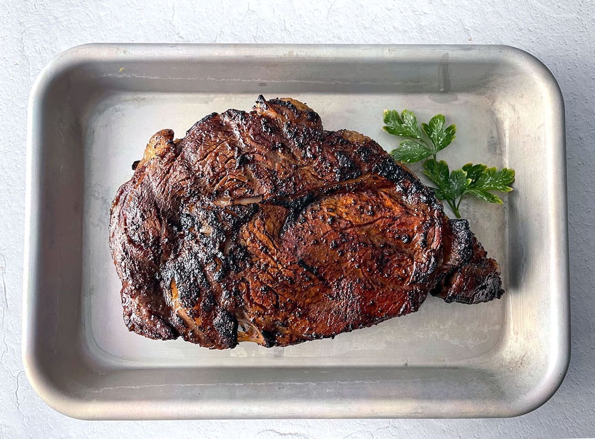 Texas Roadhouse Steak on a silver baking sheet.