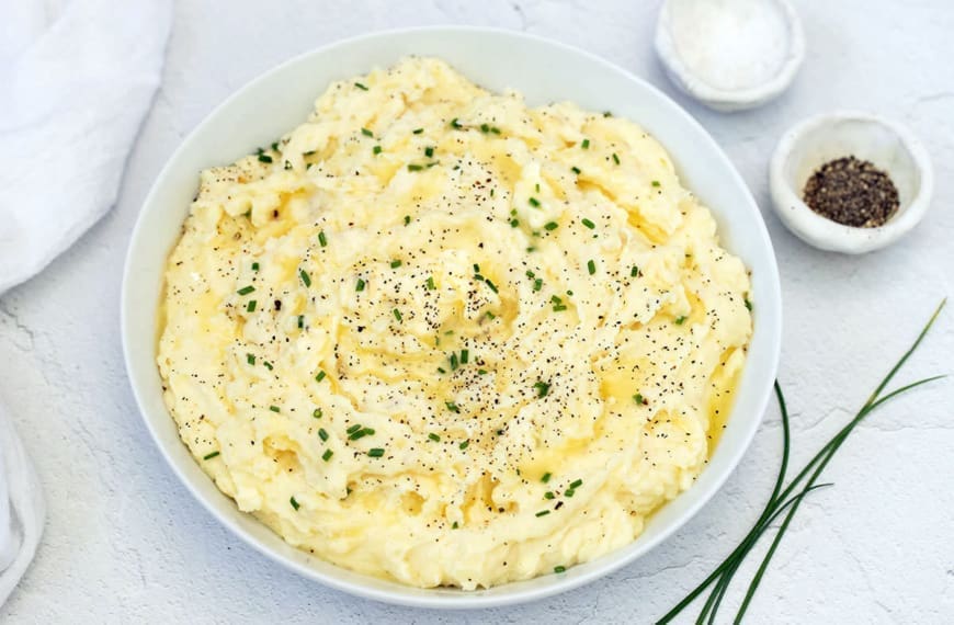 Horseradish mashed potatoes in a white bowl.