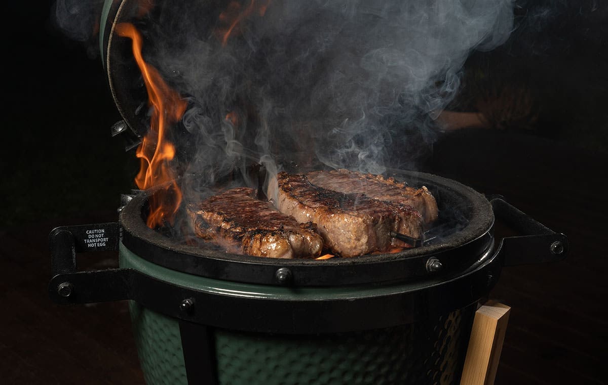 Steaks on a grill for a Best Things To Smoke In A Smoker article.