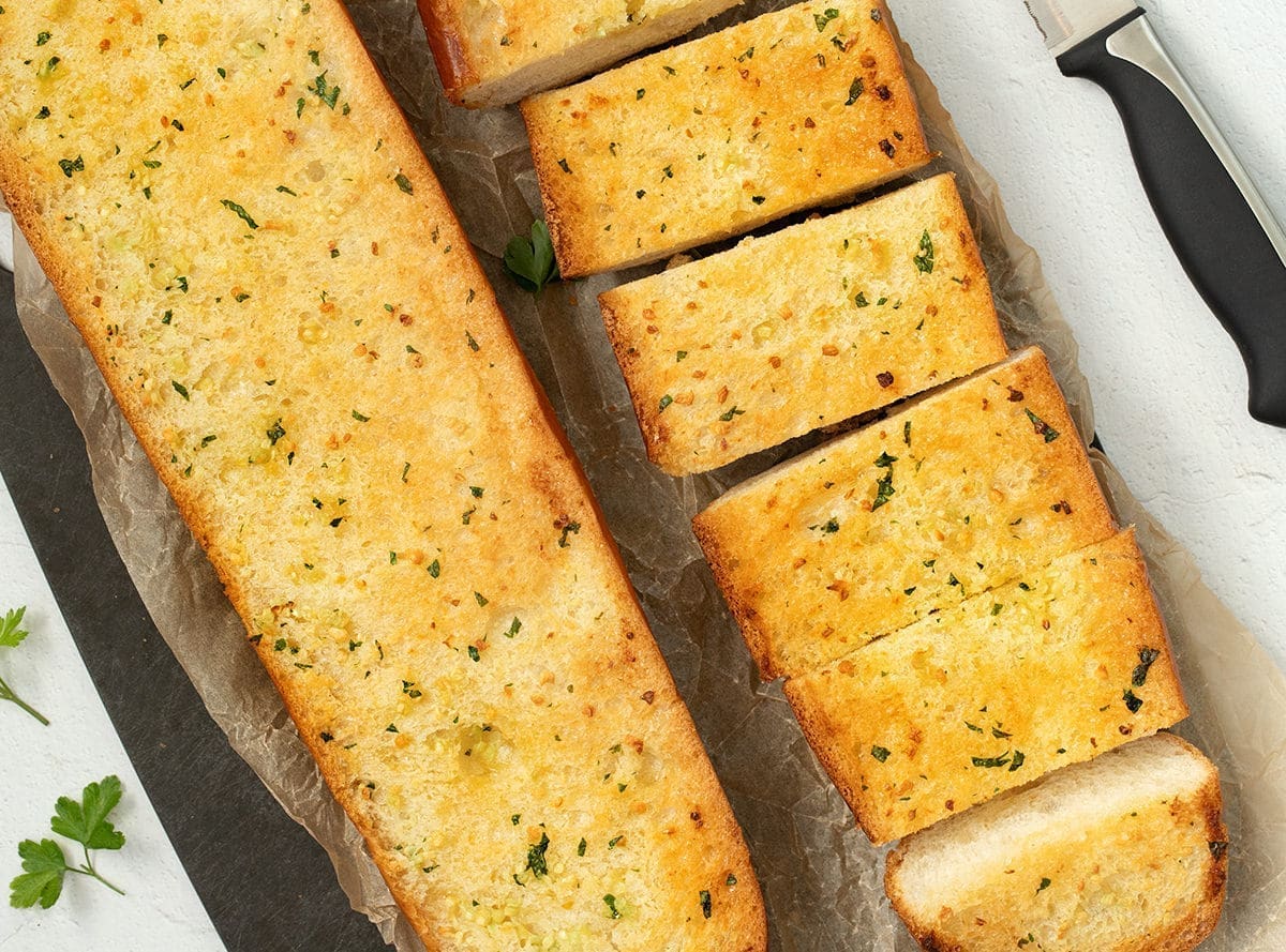 Cooked and sliced homemade garlic bread.