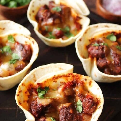 Steak Taco cups on a plate.
