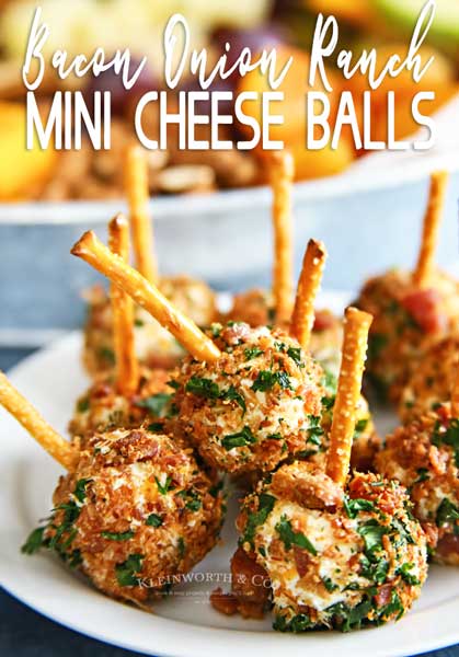 Bacon Onion Ranch Cheese balls with pretzel rods attached.