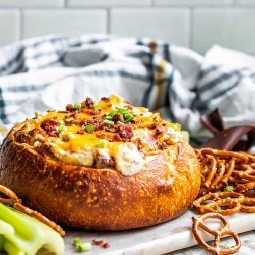 Beer cheese and pretzels in a bread bowl.
