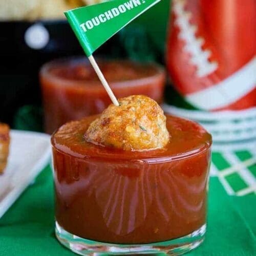 Chicken parmesan meatballs with a flag toothpick.