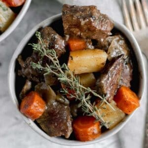 30+ Beef Chuck Roast Recipes 18 beef pot roast garnished with fresh thyme.