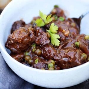 30+ Beef Chuck Roast Recipes 25 shredded beef with mushrooms in a white bowl.
