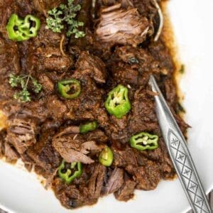 30+ Beef Chuck Roast Recipes 24 shredded beef with shishitos and a silver serving spoon.
