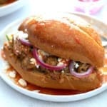 Torta Ahogada on a white plate.