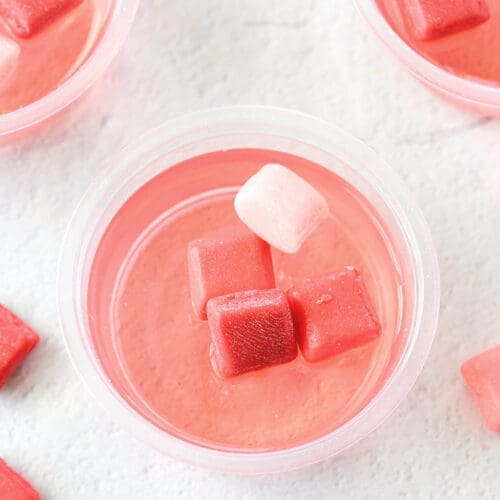 Starburst Jello Shots with candy on top.