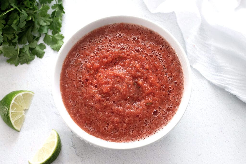 blender salsa in a small white bowl.