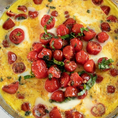 Caprese Frittata in a silver skillet.