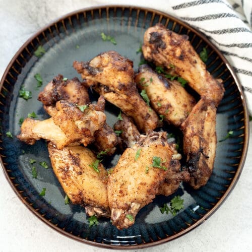 Blue Plate of Baked Jerk Chicken Wings.