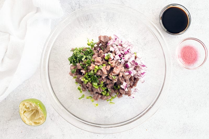 filet mignon tartare with minced onion and cilantro.