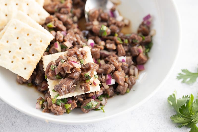 Minced meat mix on a cracker.