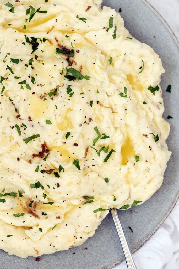 Mashed potatoes on a blue bowl.