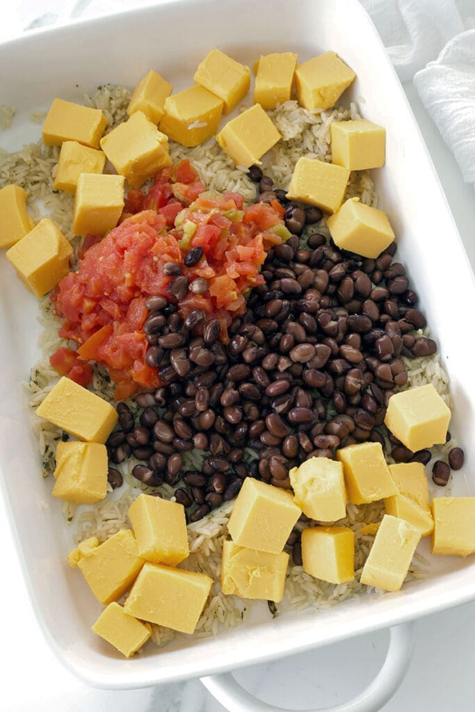 Belveta, beans and rotel on a baking dish.