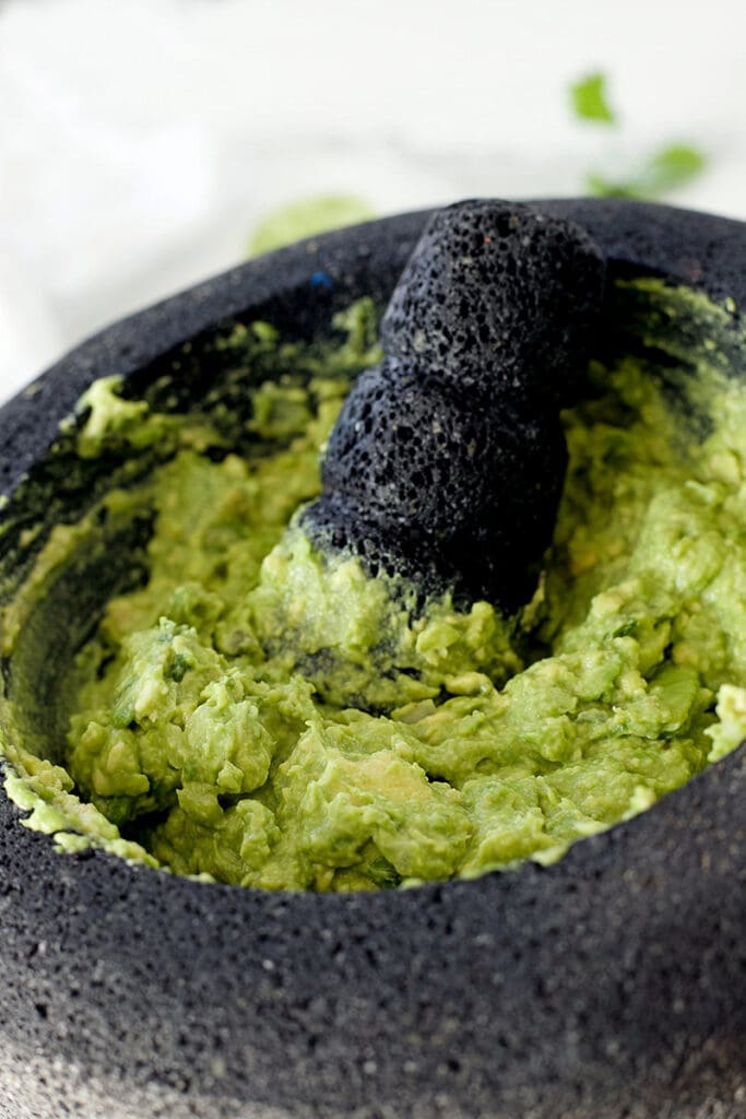 Avocados were mashed into a volcanic rock container.